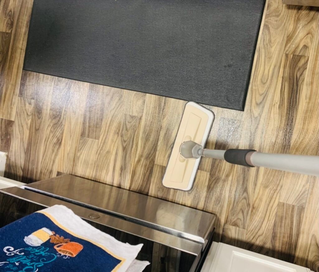 clean hardwood floors in process with a microfiber mop