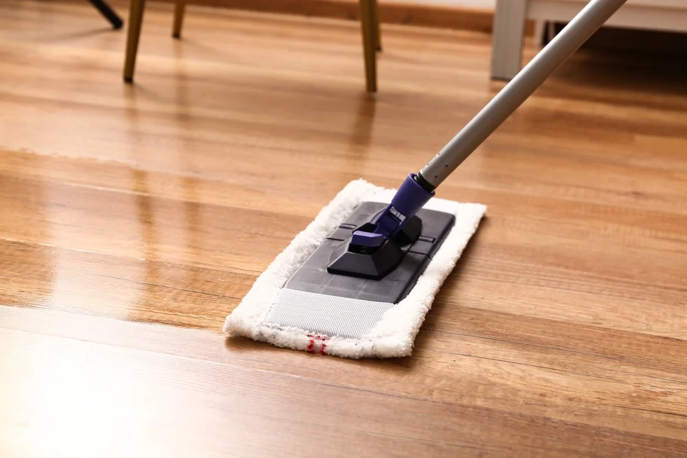 Mopping hardwood floor, images shoes a beautifuly cleaned hardwood floor with a mop, floor is shining like new